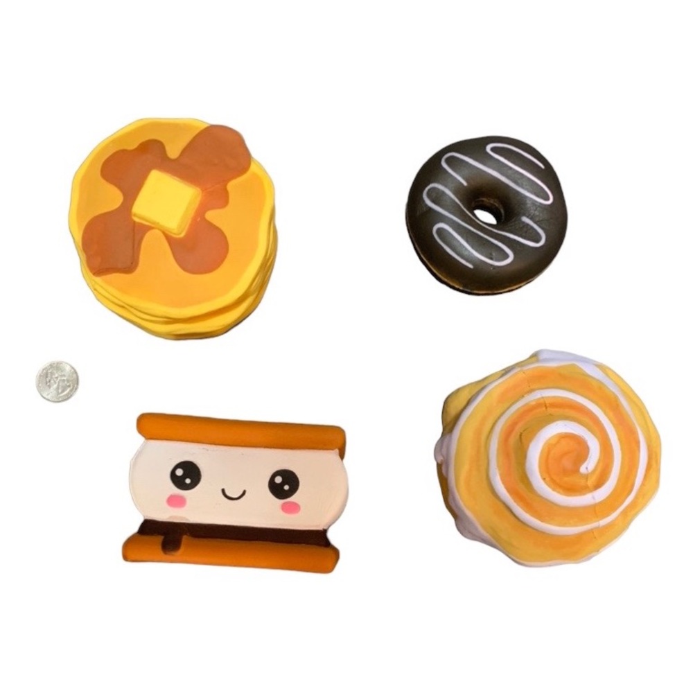 Squishies food grouping. Pancakes, s’more, cinnamon bun, and donut. Gently used